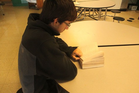 Former student Brian Baldwin spends his free time reading and studying in the student cafe during 2nd period.