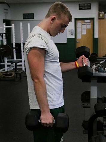 John Konopinski of Mr. Probst’s second period class, reps out a set of bicep curls on November 20th.