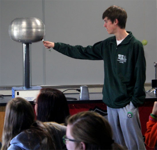 During Mr. Repas 2nd period physics class, Jimmy Wiltzuis voluntarily takes the front to test out the Van De Graff Generators strength.