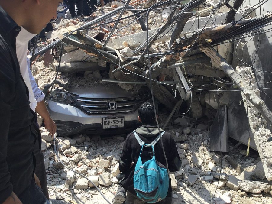 Car in The city of Mexico stuck under rubble after category 4.9 earthquake.