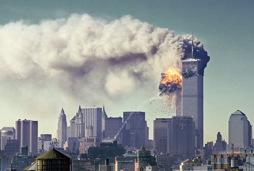 The Twin Towers of The World Trade Center burn in New York City on September 11, 2001.