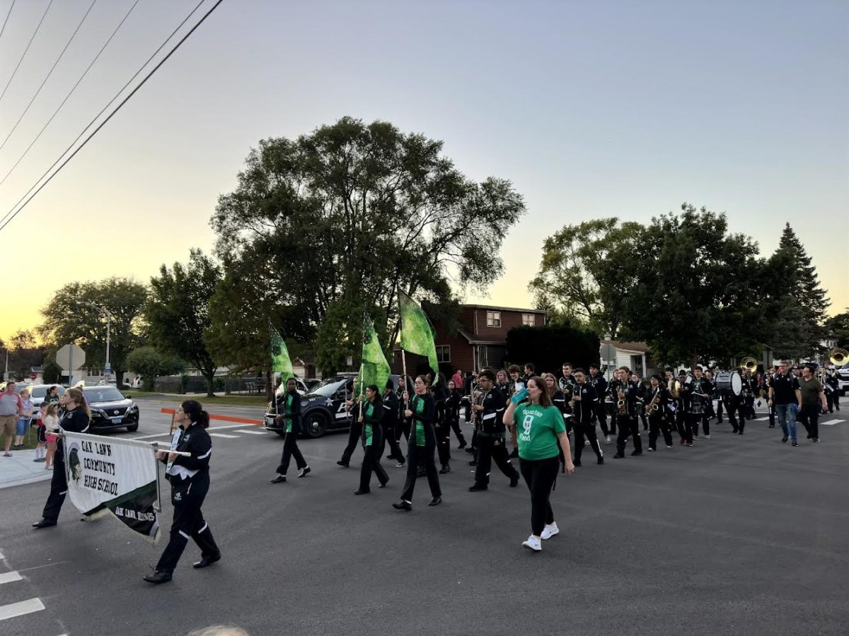 The Band playing their music while marching down Austin Avenue for the parade. 